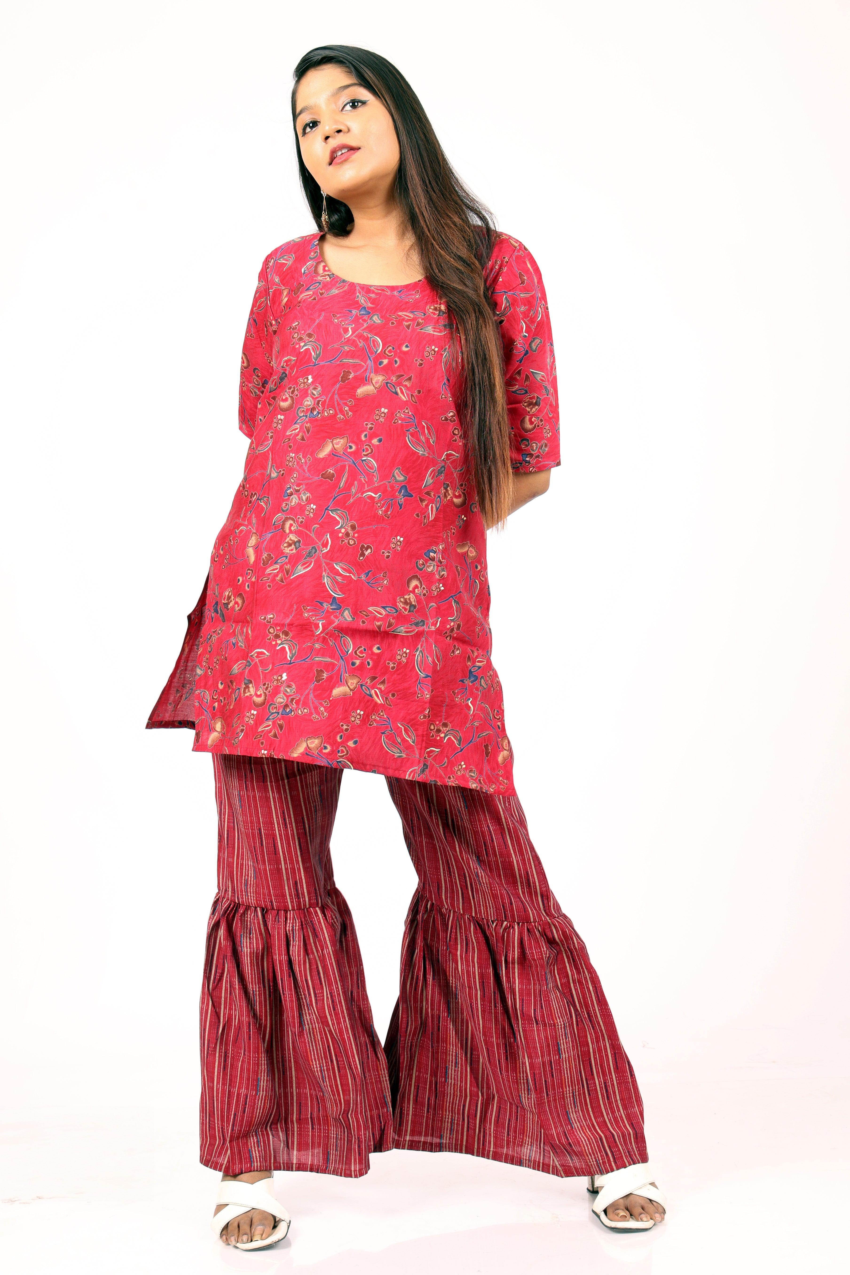 Ethnic style red floral-printed kurta and flared palazzo set.