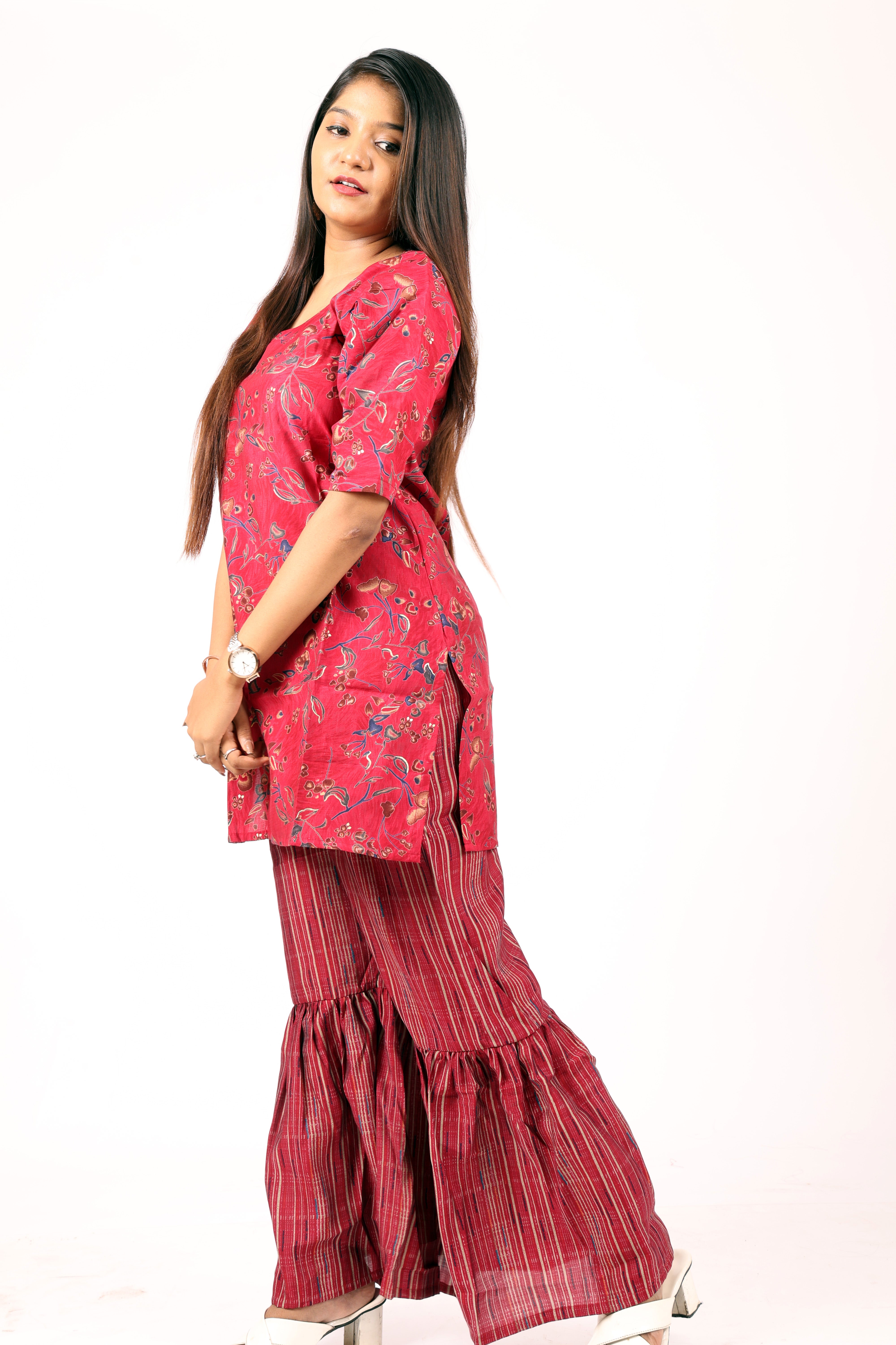 Ethnic style red floral-printed kurta and flared palazzo set.