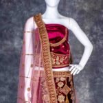 Semi-stitched dark magenta velvet lehenga set with gold zari and stone work