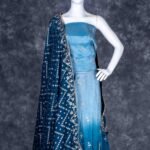 Semi-stitched teal blue lehenga set with silver zari and bead work