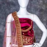 Semi-stitched dark magenta velvet lehenga set with gold zari and stone work