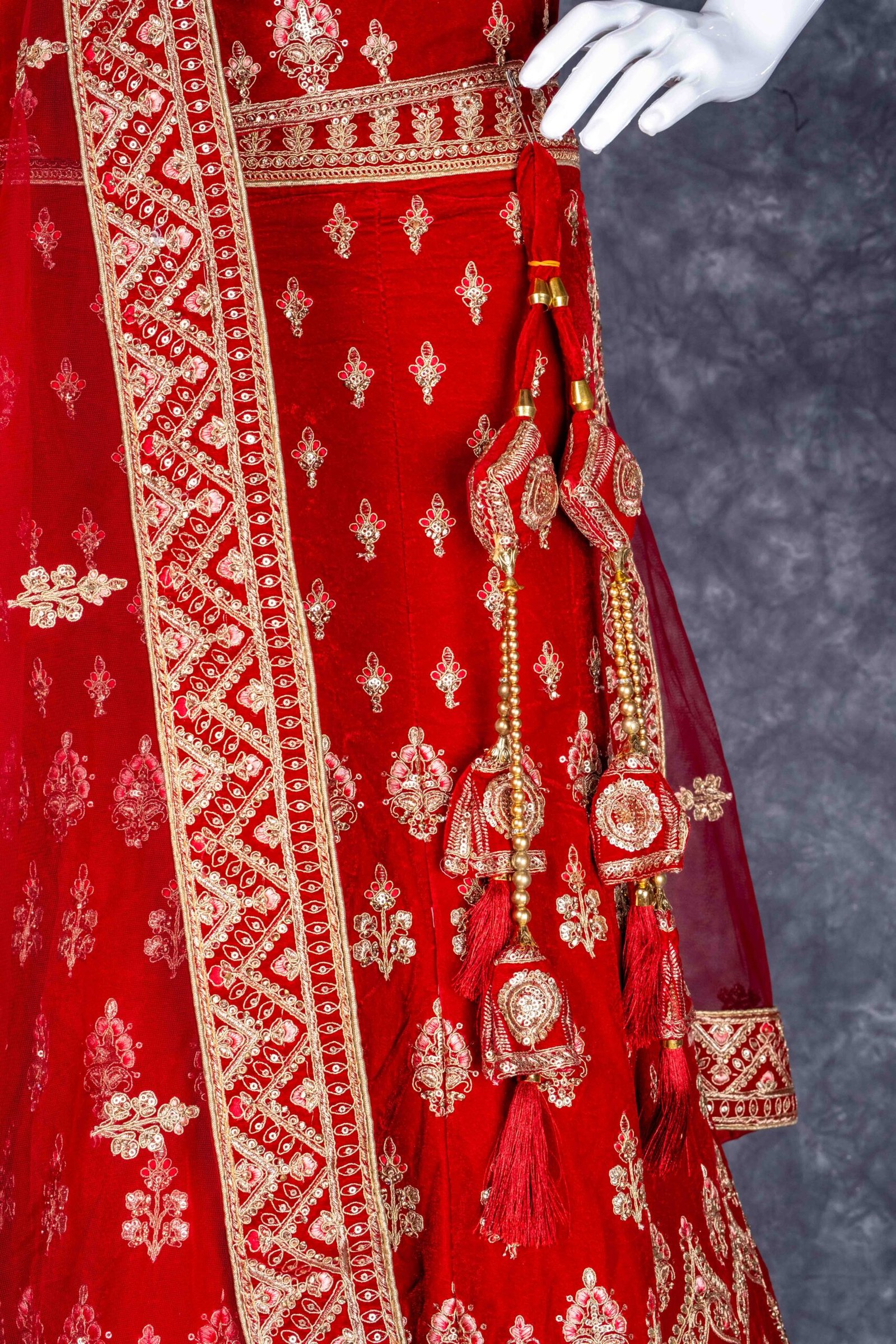 Semi-stitched Red velvet lehenga set with gold zari and stone work