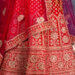 Semi-stitched red velvet lehenga set with gold zari and stone work